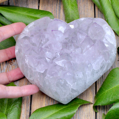 Amethyst Druzy Heart shown with hand for scale