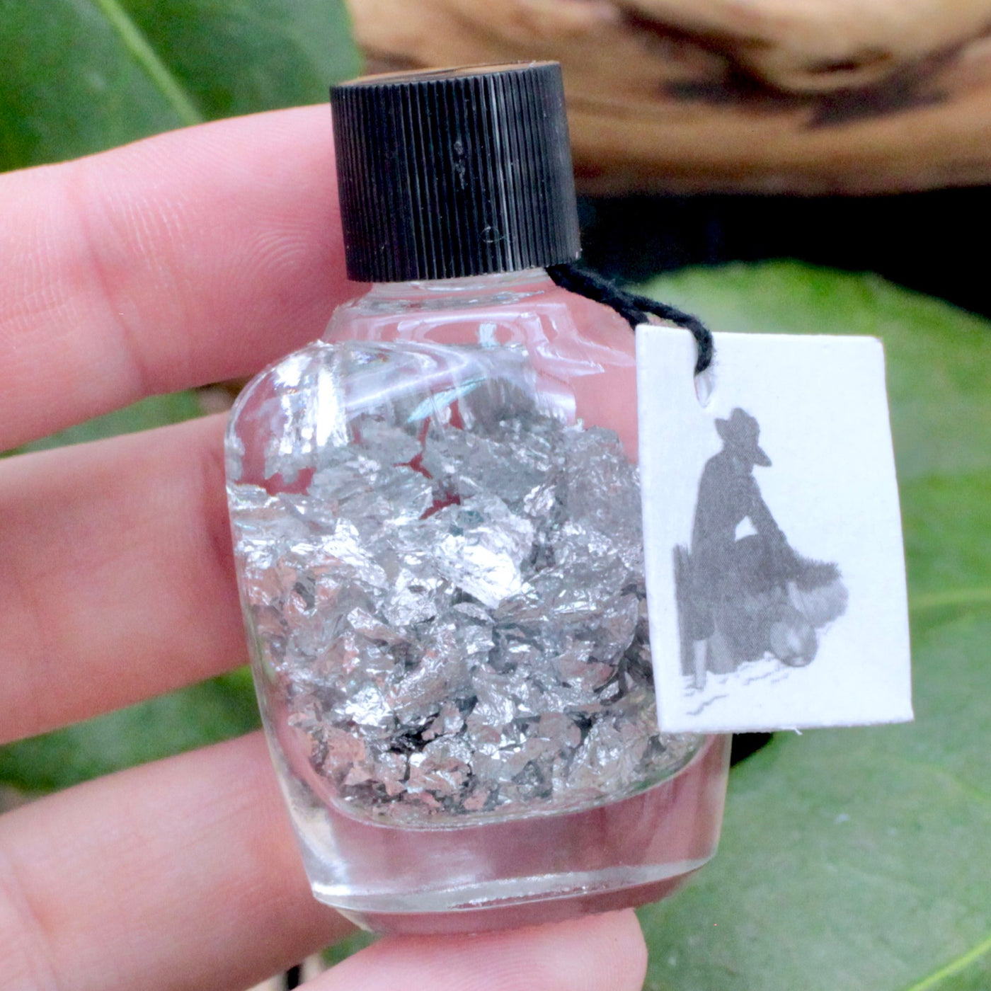 Silver Flakes in Bottle hand